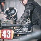 Mechanic in Blue Suit Contemplating Go-Kart Repairs