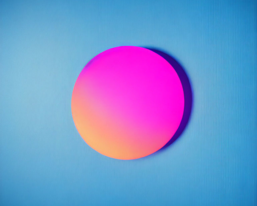 Gradient circle in pink and orange on textured blue background