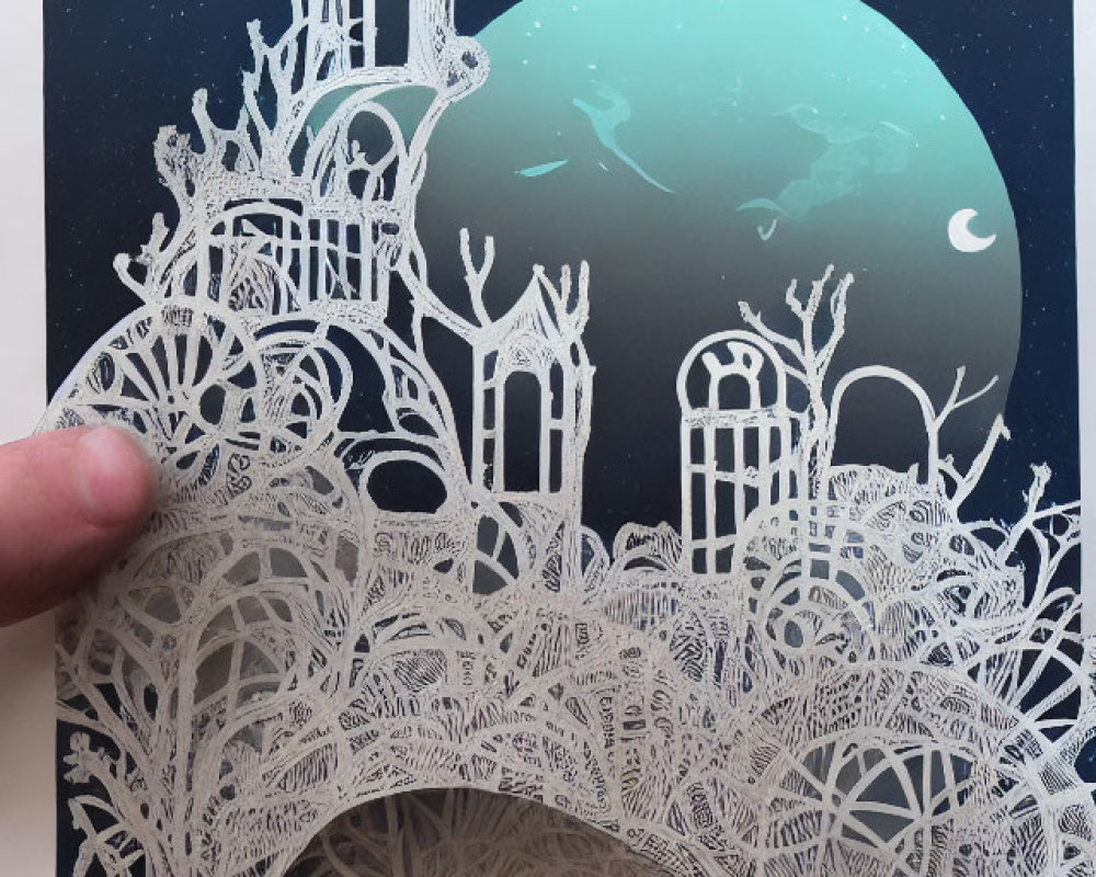 Intricate paper cut-out artwork of trees, architecture, stars, and teal moon