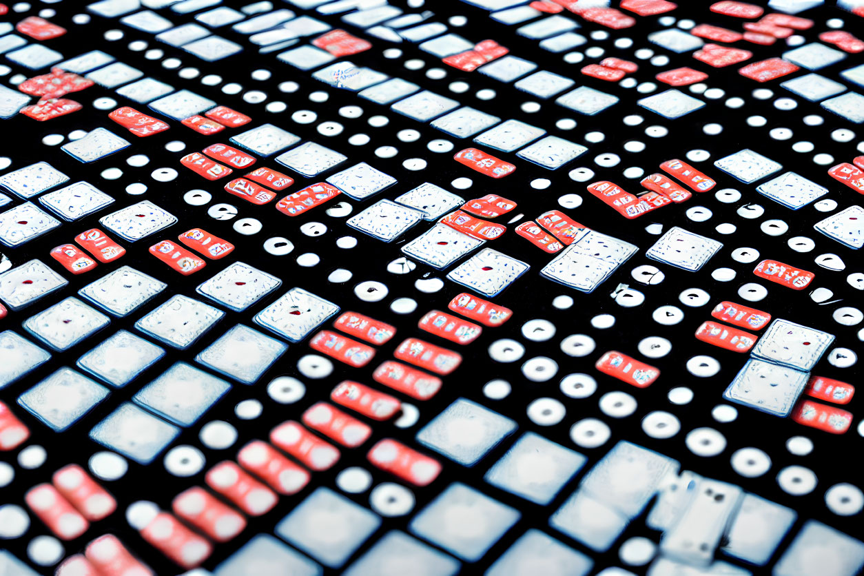 Scattered Red and White Dominoes on Black Surface