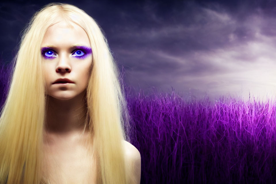 Portrait of young woman with purple eyes and blonde hair against dramatic dusk sky.