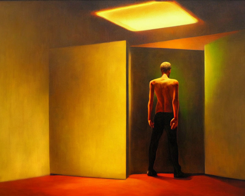 Shirtless man standing in yellow room with dramatic lighting