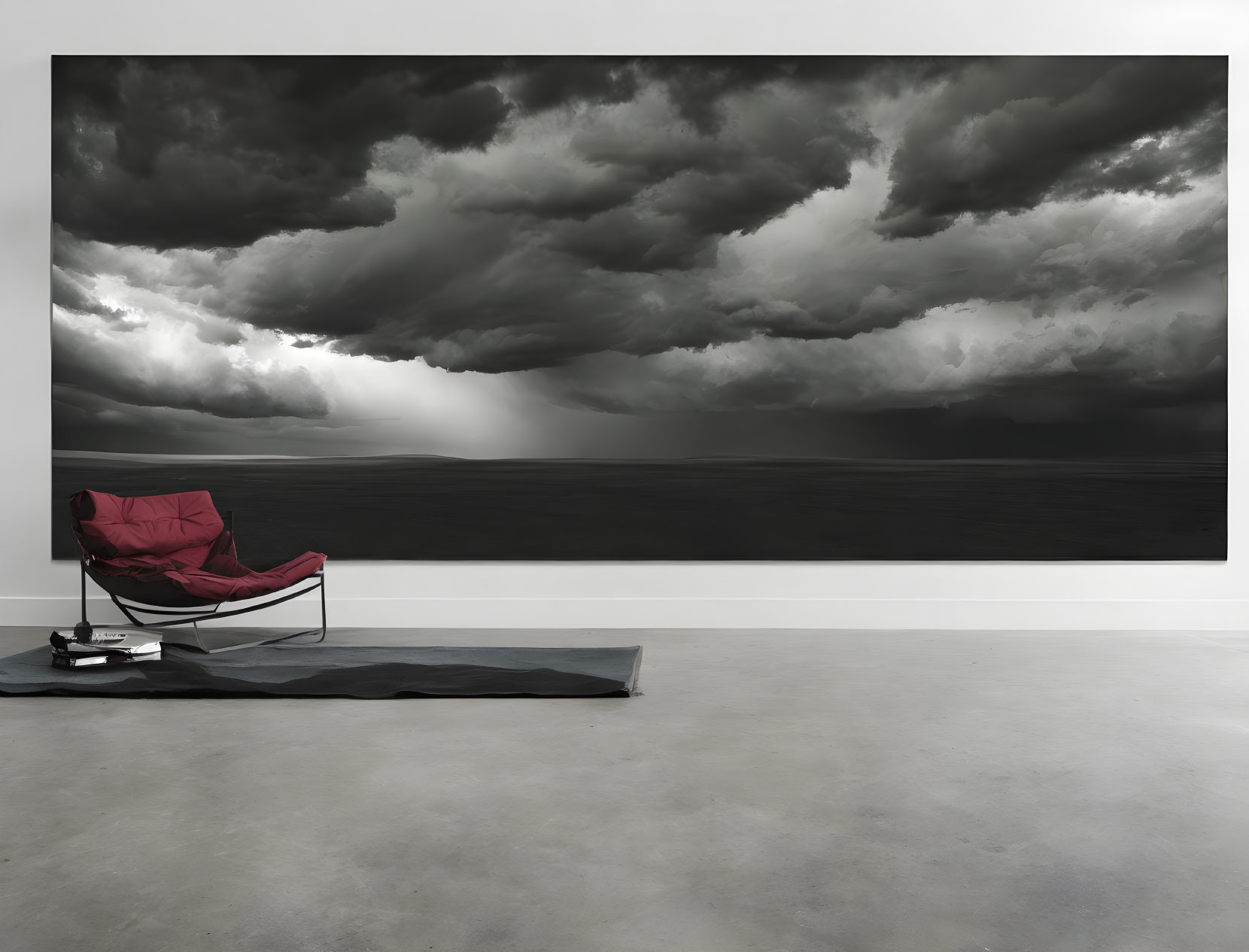 Red chair against grayscale photo of stormy clouds