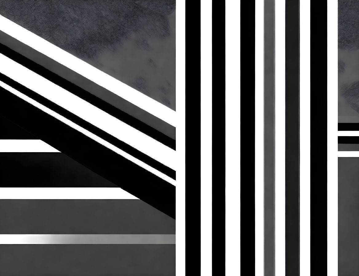 Contrast of textures in abstract image: gritty gray surface and black & white vertical stripes.