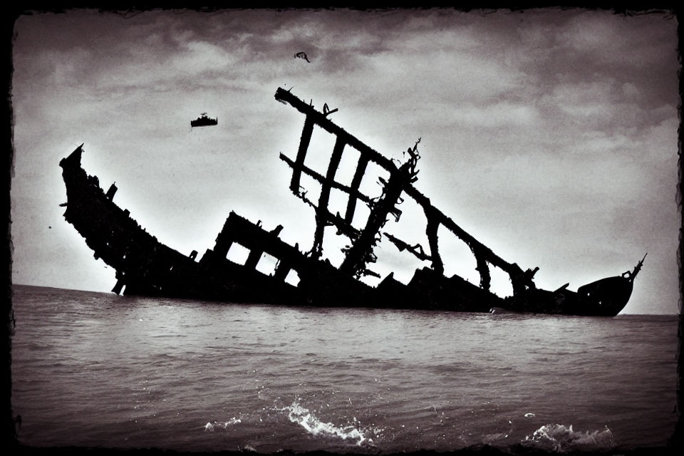 Sepia-Toned Shipwreck Skeleton Emerging from Sea with Dramatic Sky