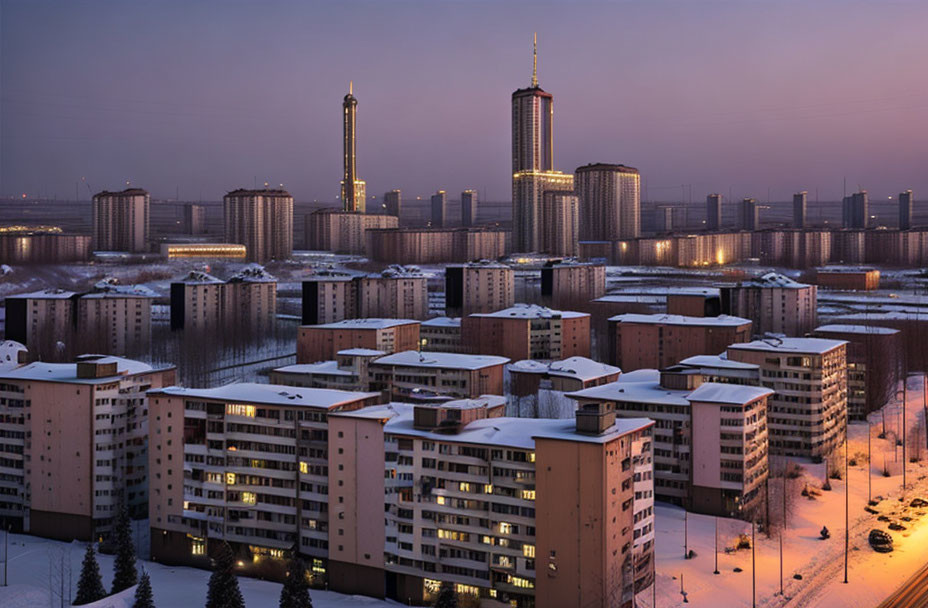 Snow-covered cityscape at dusk with residential and skyscraper buildings under twilight sky