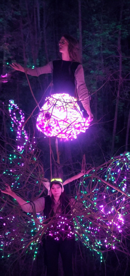 Woman illuminated in colorful lights with support below