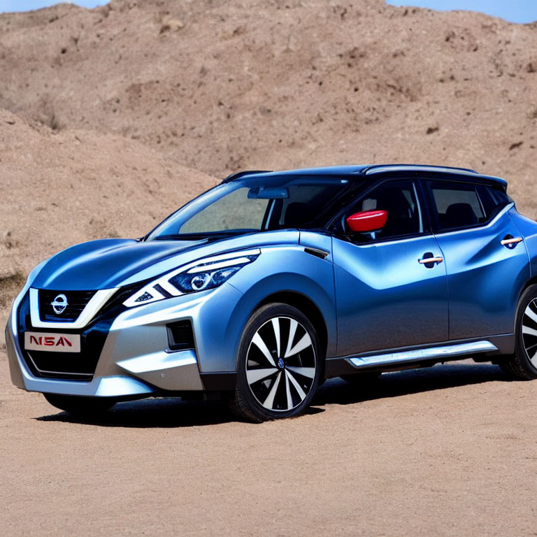 Blue Nissan SUV Parked on Sandy Terrain with Modern Alloy Wheels