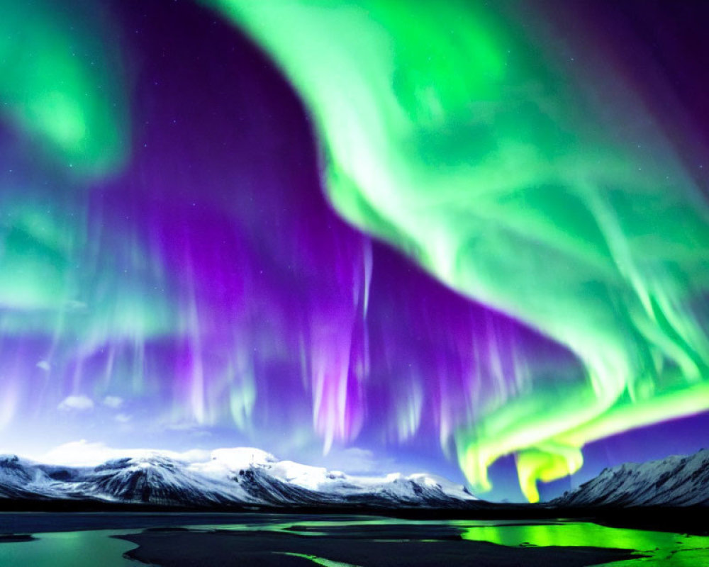 Stunning Northern Lights over snow-capped mountains