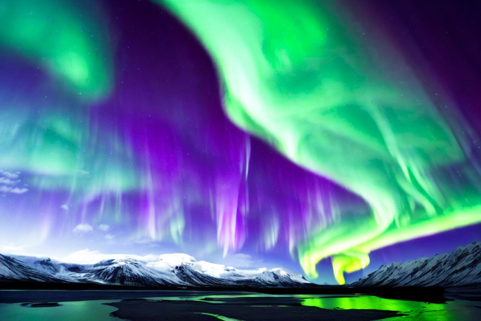 Stunning Northern Lights over snow-capped mountains