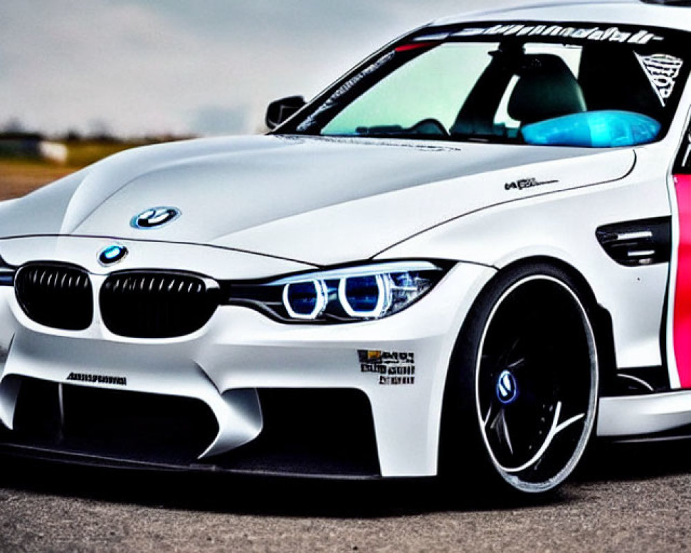 Custom White BMW M Series Car with Sporty Bodywork & Blue-Rimmed Headlights