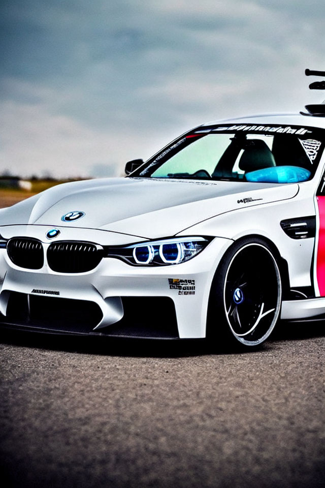 Custom White BMW M Series Car with Sporty Bodywork & Blue-Rimmed Headlights