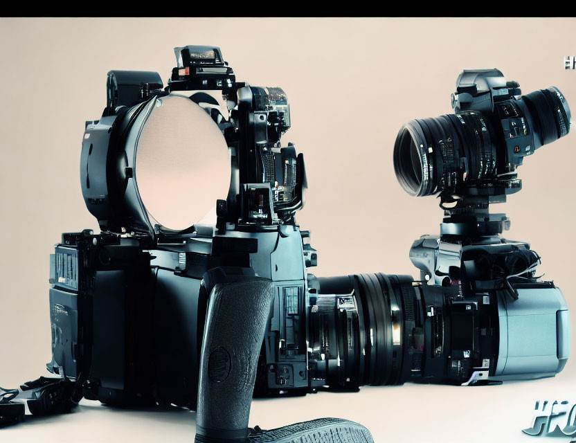 Professional Camera Equipment Displayed on Light Background