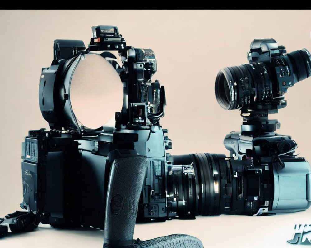 Professional Camera Equipment Displayed on Light Background