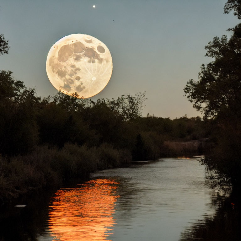 Detailed Full Moon Over Tranquil River and Silhouetted Trees at Twilight