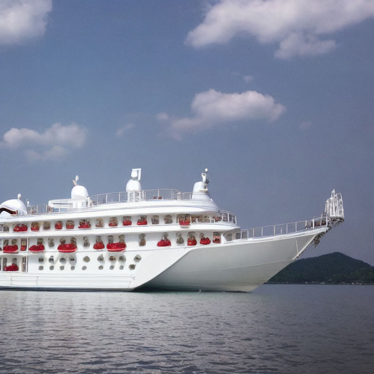 White Cruise Ship Sailing on Calm Blue Waters with Clear Skies