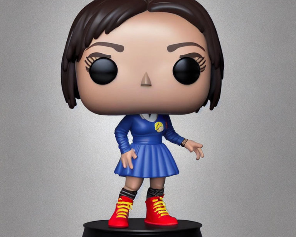 Female character Funko Pop! vinyl figure in blue dress with badge and striped socks