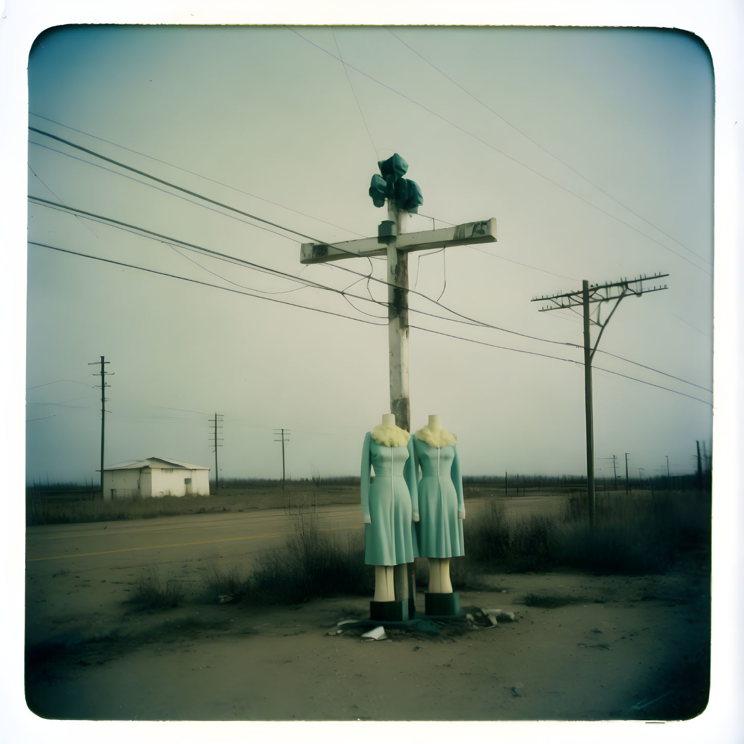 Desolate roadside with dilapidated traffic light and faded billboard