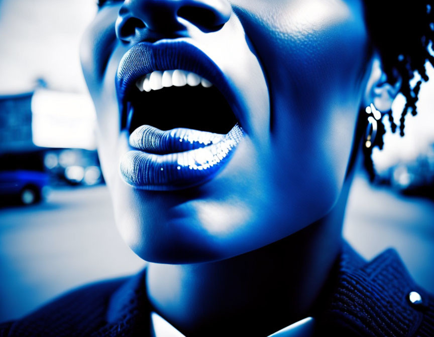 Detailed close-up portrait with open mouth and highlighted lips in blue tones against urban backdrop.