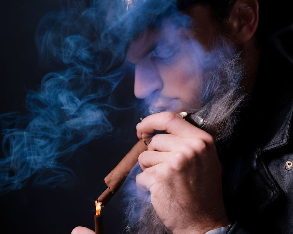 Man in Fedora Lighting Cigar Surrounded by Blue Smoke