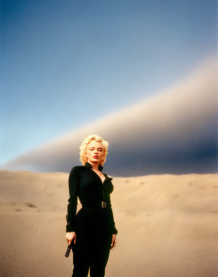 Blonde woman in black outfit standing confidently in desert landscape