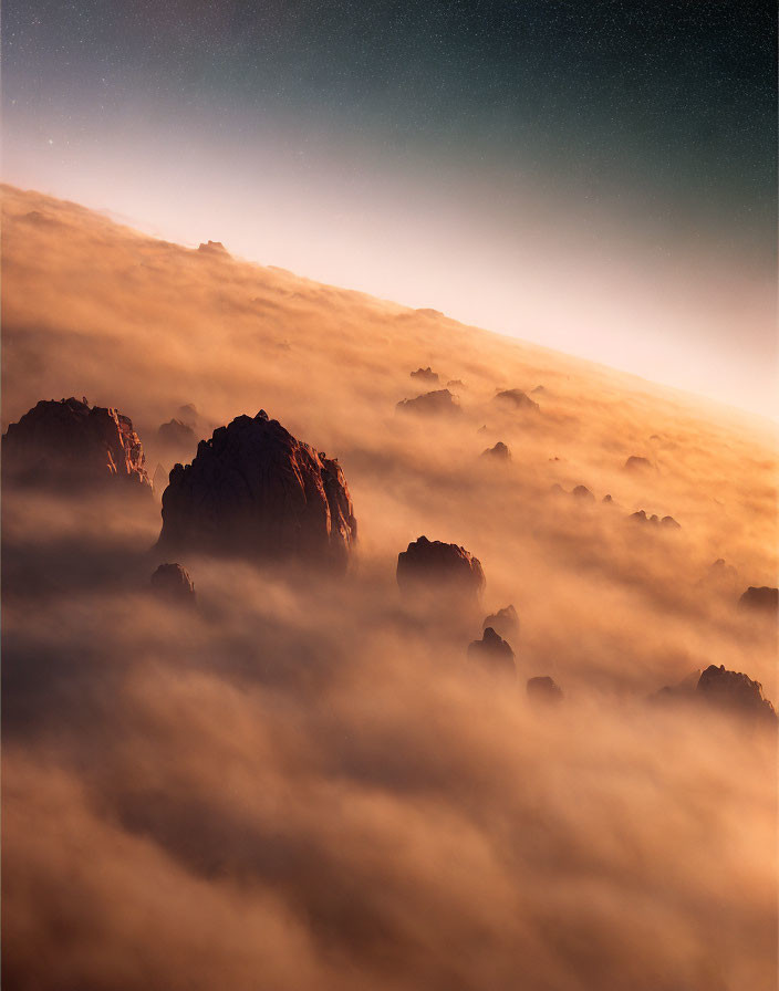 Twilight sky with mountain peaks above clouds