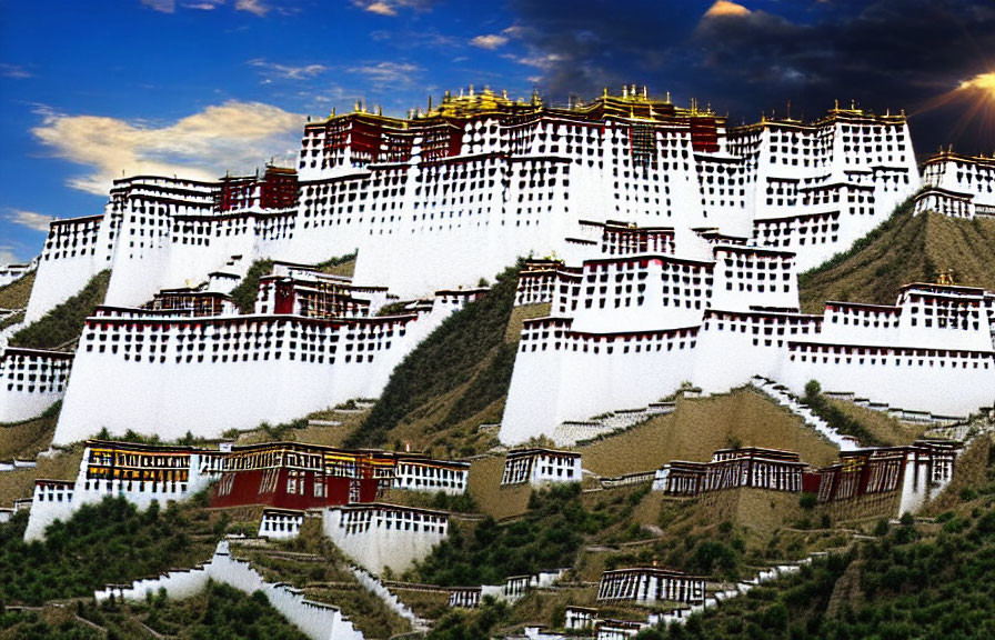 Historic Tibetan Palace Complex with White Walls and Golden Roofs