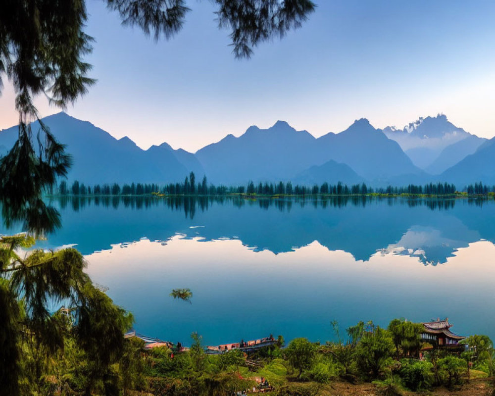 Twilight lake scene with mountains, pavilion, and lush trees