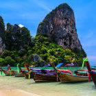 Tropical beach scene with traditional long-tail boats