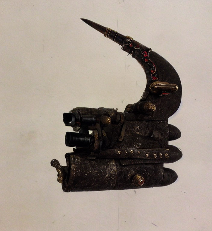 Steampunk-themed prosthetic hand with gears and metal plating