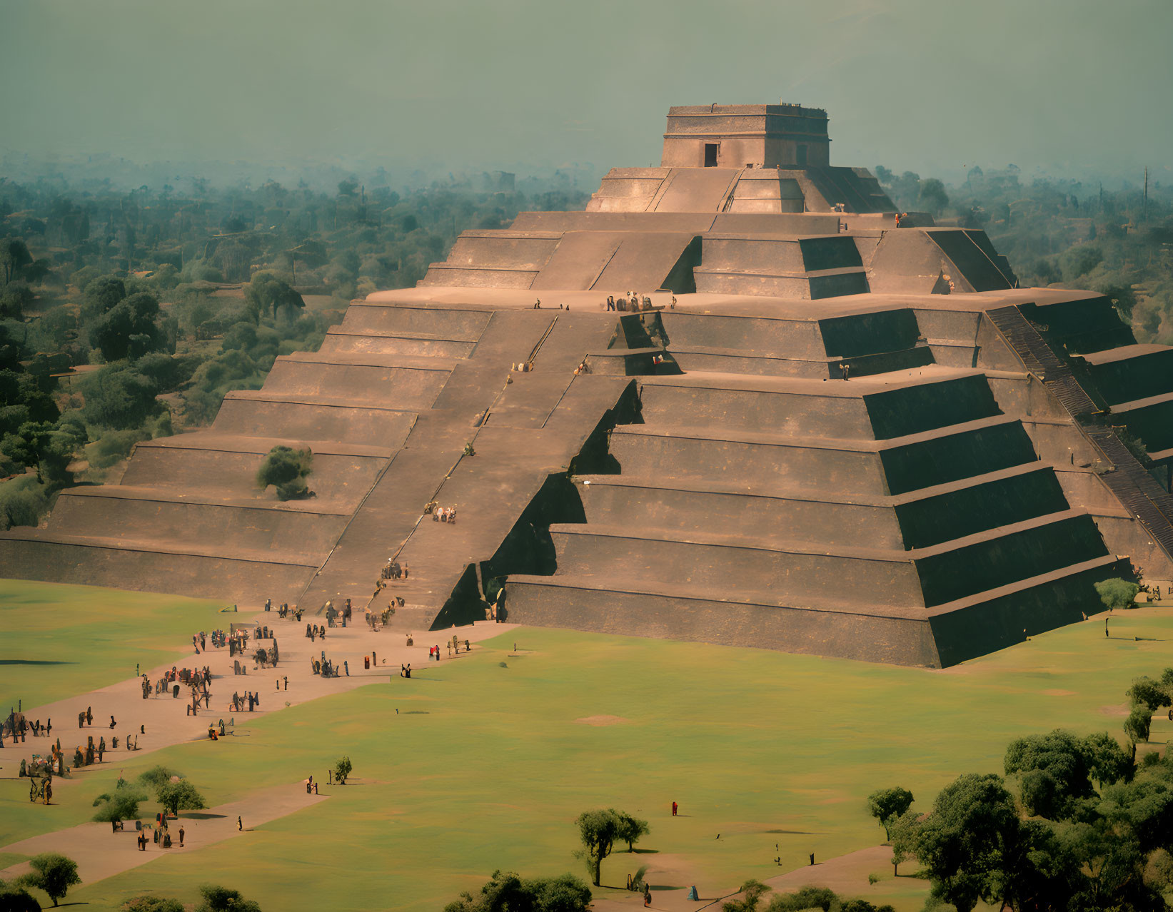 Ancient Mesoamerican Pyramid with Staircases and Visitors Walking Around Grass Base