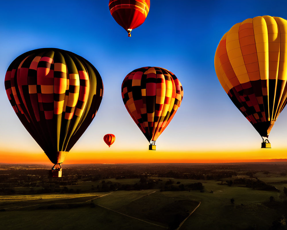 Sunset hot air balloons flying over clear sky with orange horizon