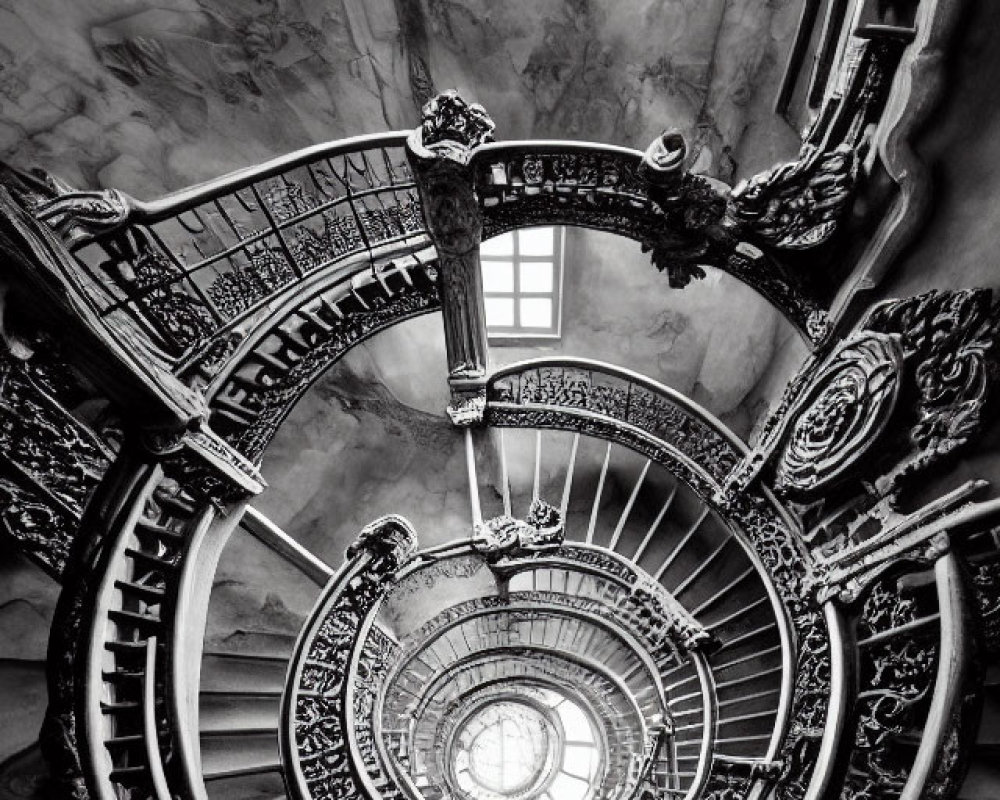 Monochrome spiral staircase with ornate iron railings and round window