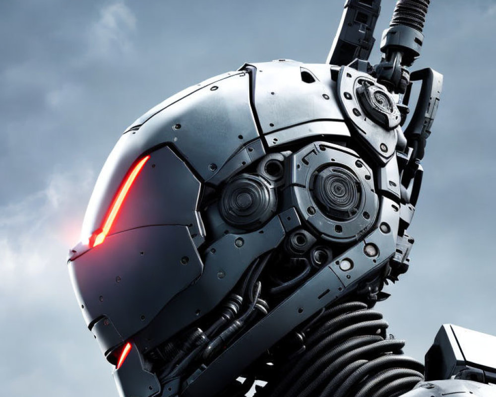 Detailed Robotic Head with Red Glowing Eyes Against Cloudy Sky