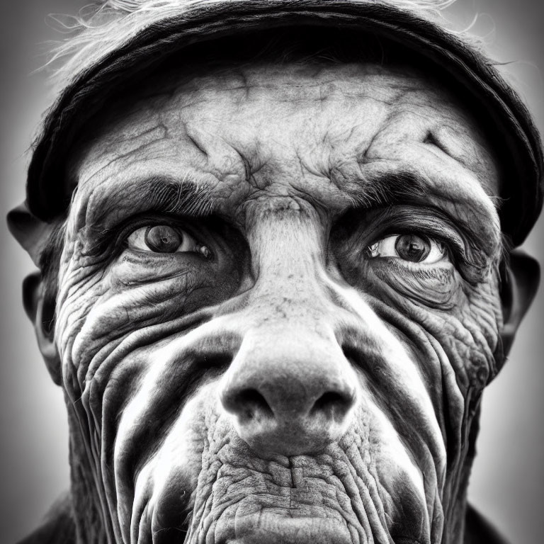 Elderly person with deep wrinkles in black and white portrait