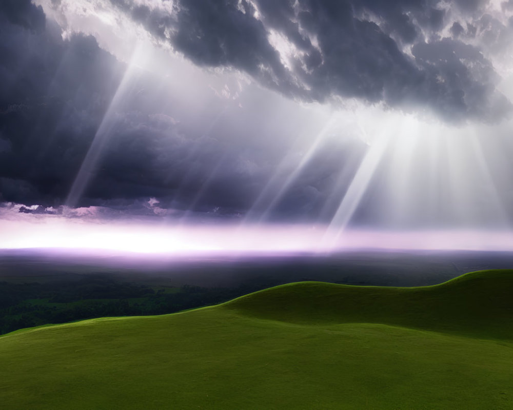 Sunbeams through dark clouds on lush green landscape