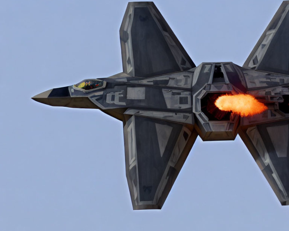 Military Jet with Angular Camouflage in Flight with Afterburner Flame