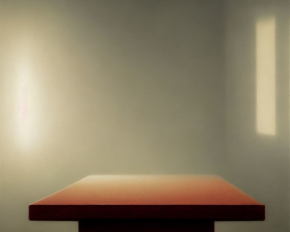 Minimalist red table in softly lit room with shadowed wall