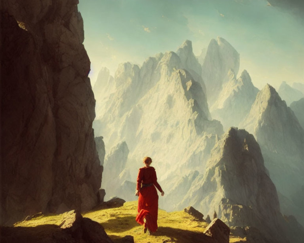 Person in Red Outfit Observing Majestic Mountain Range