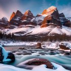 Sunset over Snow-capped Mountains and River with Orange and Purple Vegetation