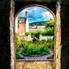 Scenic garden pathway to ivy-covered house with stained glass door