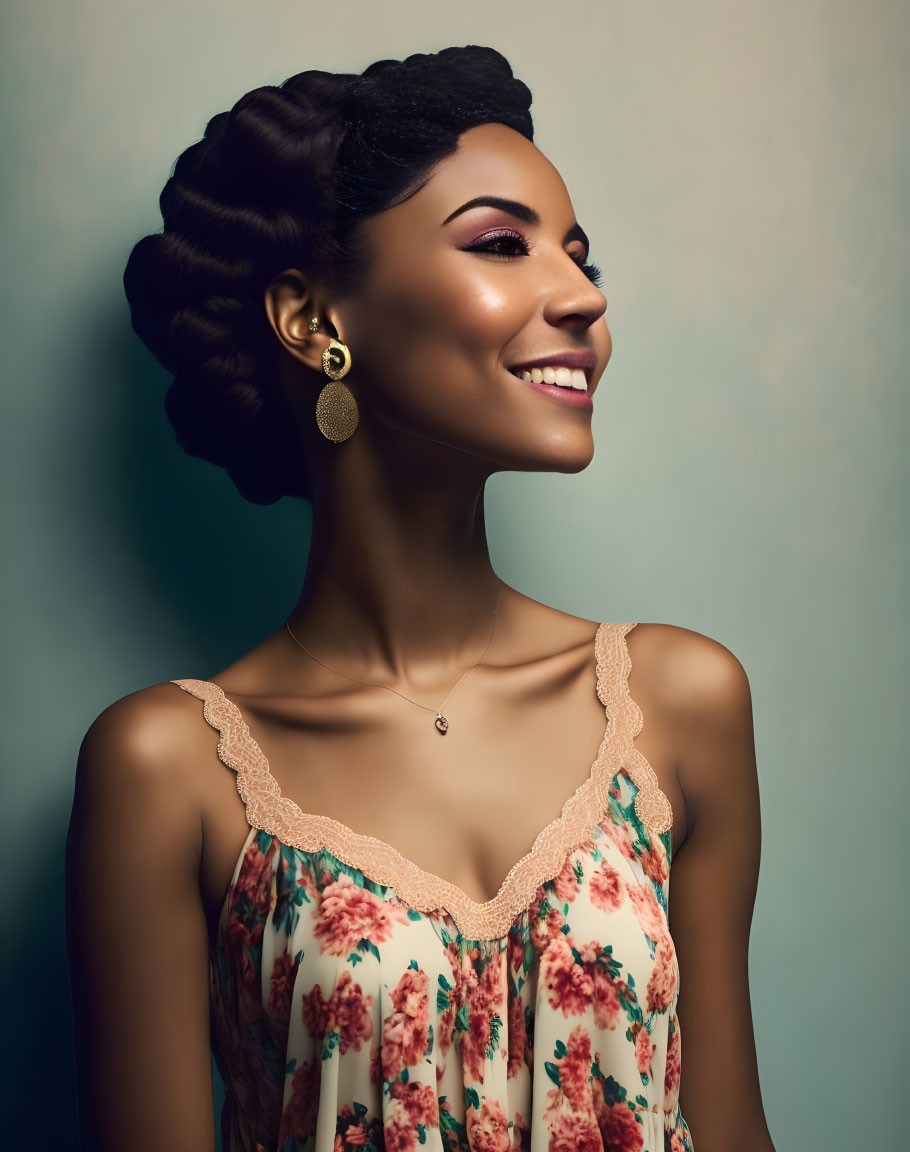 Smiling woman in floral top with elegant updo hairstyle