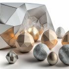 Geometric metallic objects with golden spheres on white background