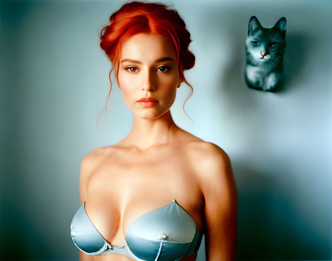 Red-Haired Woman in Silver Top with Blurred Cat Image on Blue Background