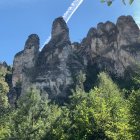 Fantastical structures on craggy hills under a clear blue sky