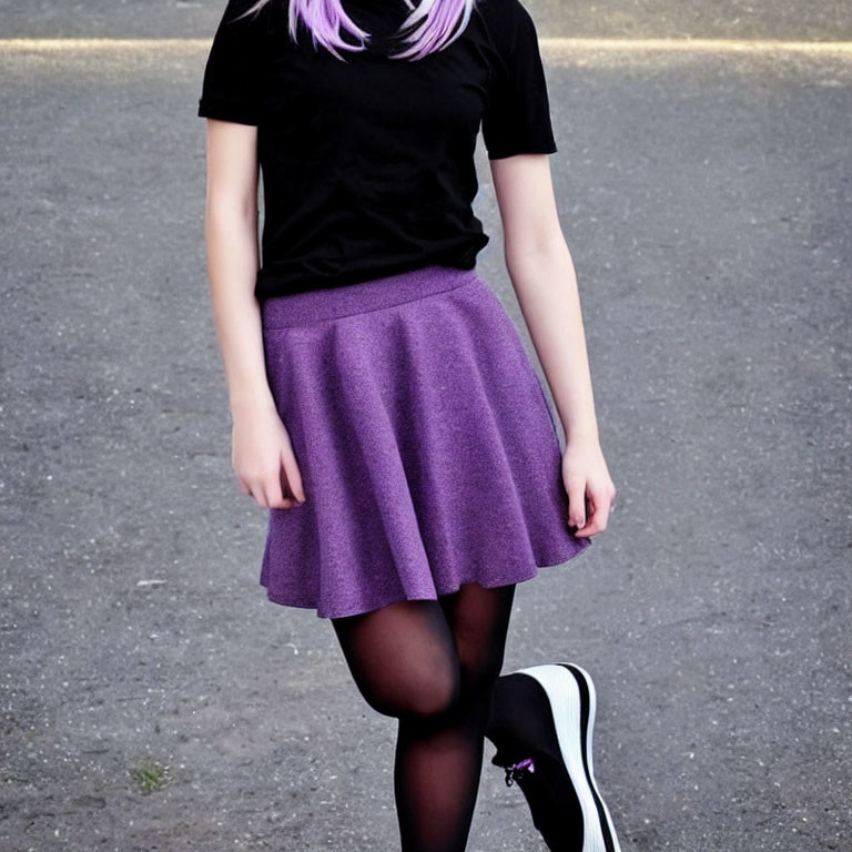 Individual in Black Top, Purple Skirt, Black Tights, White Sneakers on Asphalt