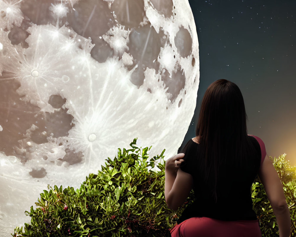 Woman sitting on ledge under large moon in starry night sky.