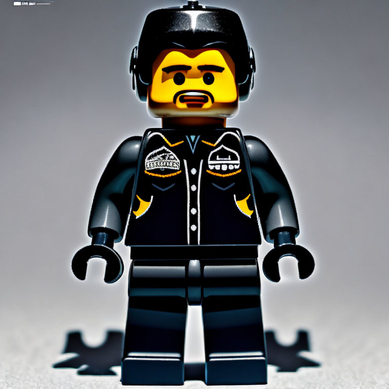 LEGO minifigure with beard in black jacket and badges