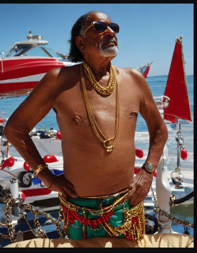 Elderly man in sunglasses and gold chains on sunny dock