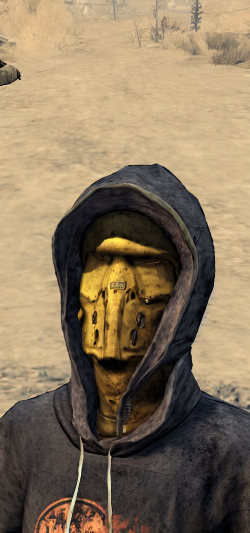 Hooded figure with yellow distressed mask in desolate landscape